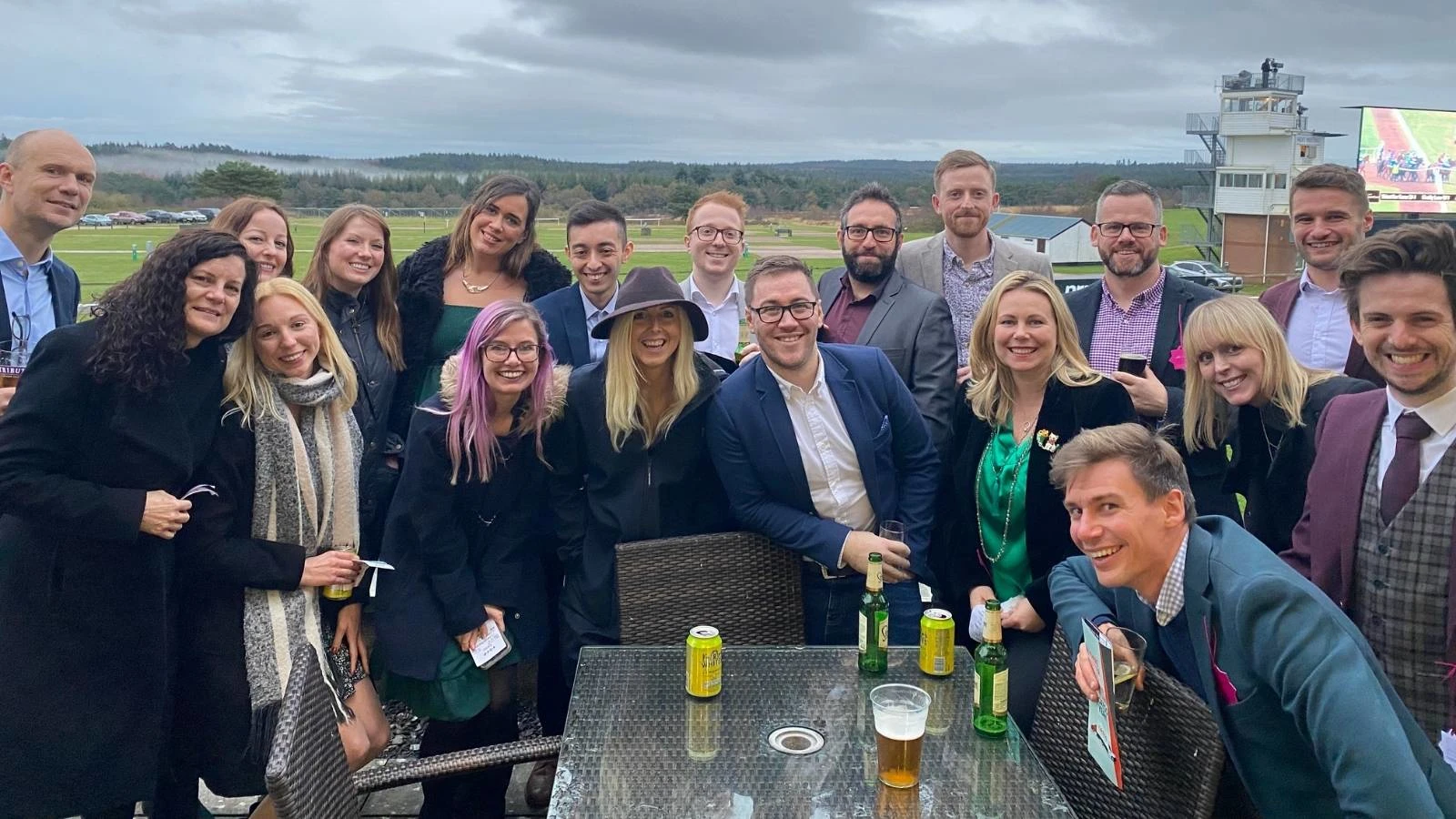 The Launch Team at the races, all smiling at a camera