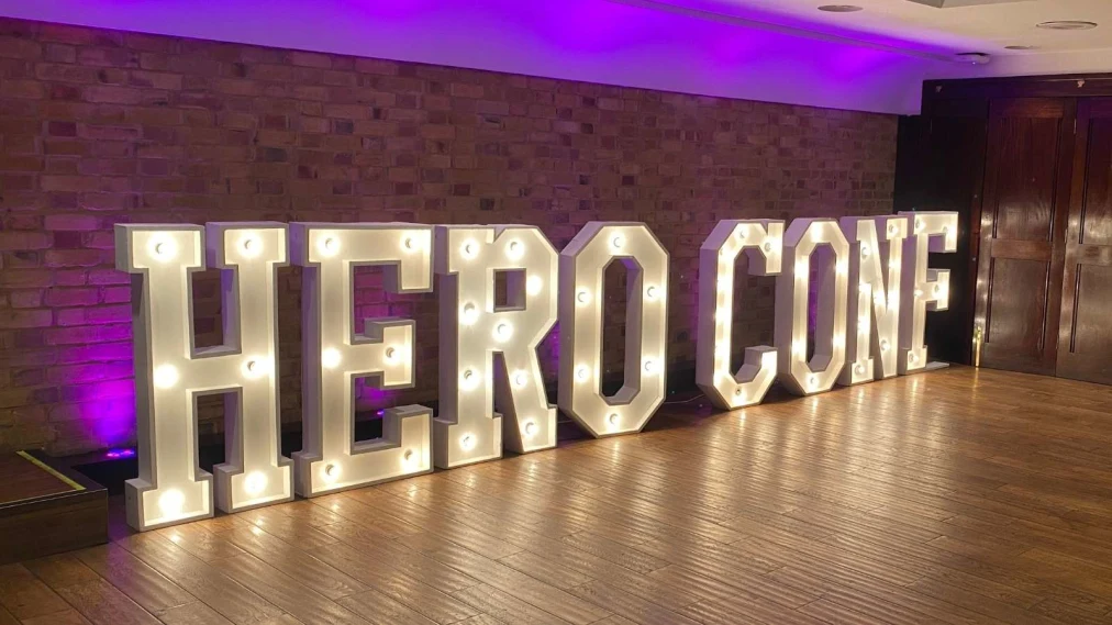 Hero Conf written in large light display