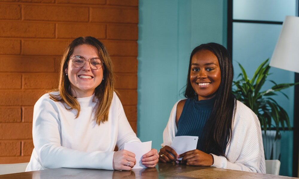 Image shows Harriet Barter and Tanisha Ferguson from the paid media team at Launch smiling to camera